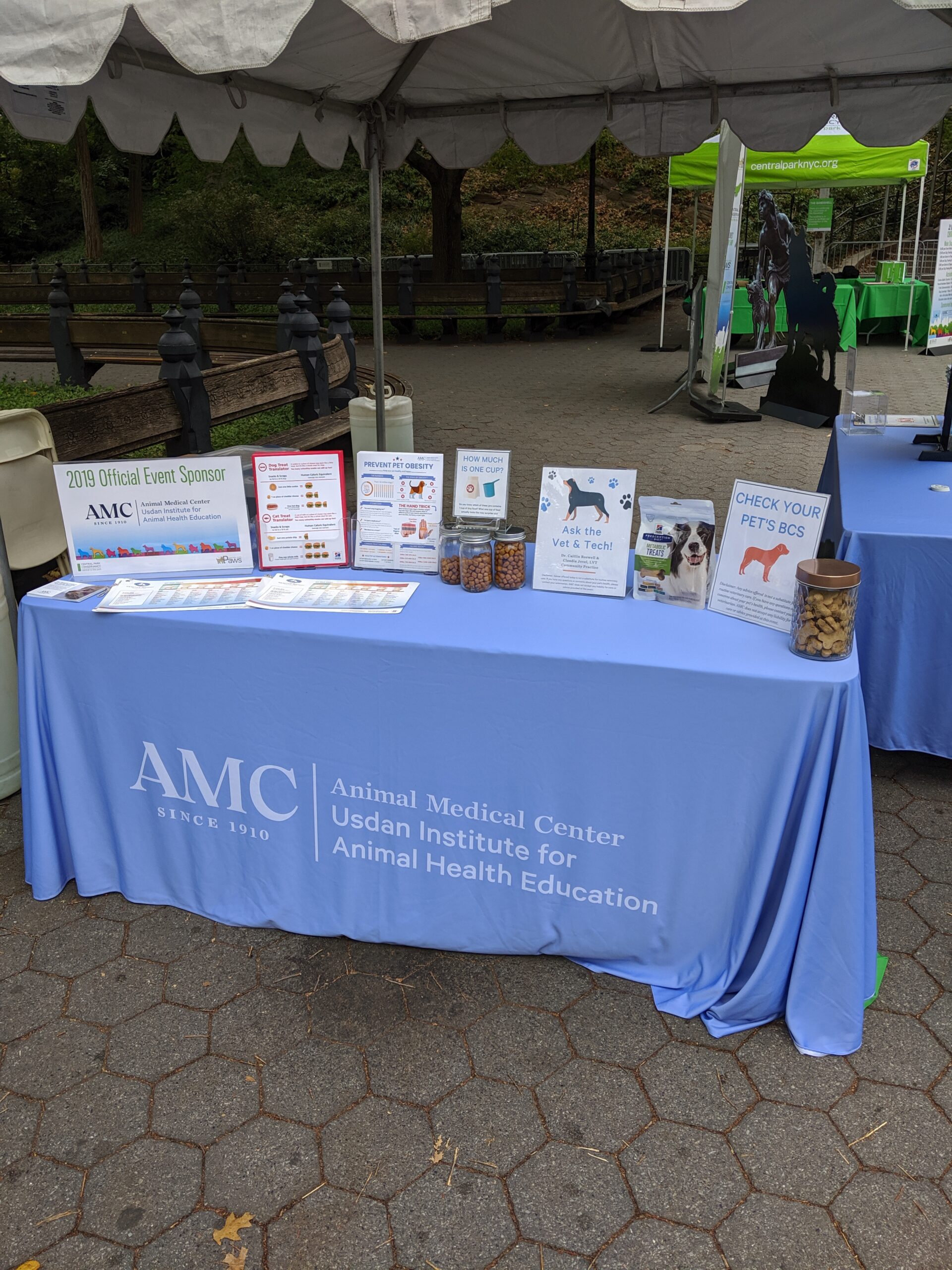 AMC table with pet health information at My Dog Loves Central Park Fair