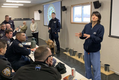 The Animal Medical Center's Dr. Heather Brausa conducts an educational seminar for NYPD K9 officers