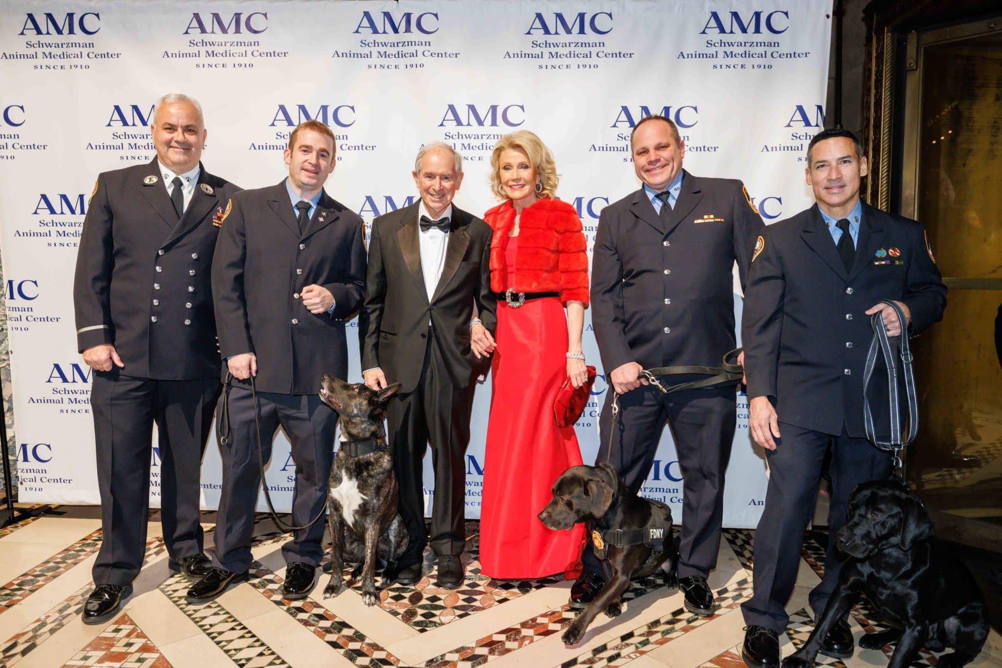 Stephen and Christine Schwarzman with members of the FDNY K9 team at AMC's Top Dog Gala