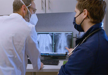 Veterinarian studies an x-ray