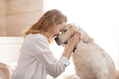 A woman hugging a dog